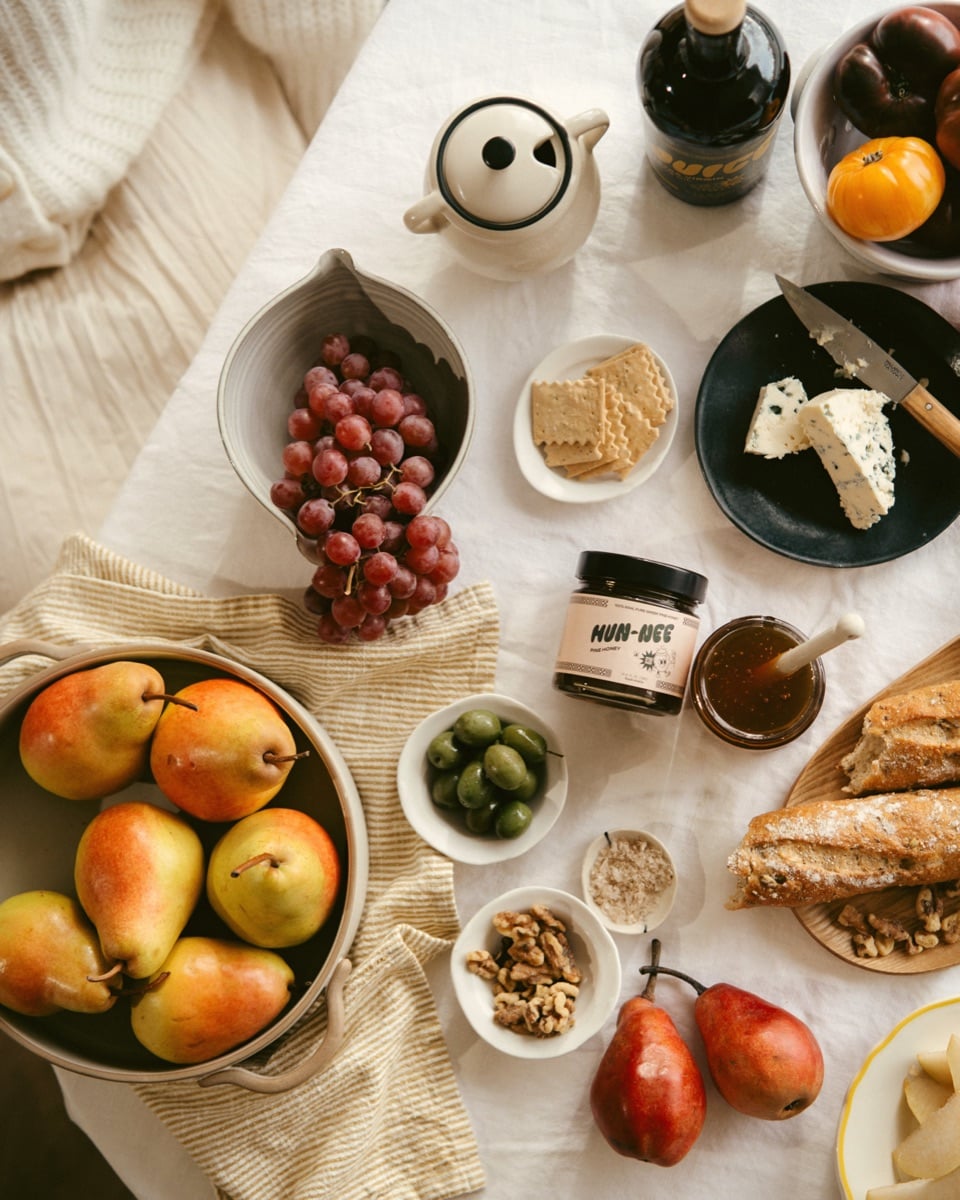 Jar of Hun-Nee pine honey on a table with food.