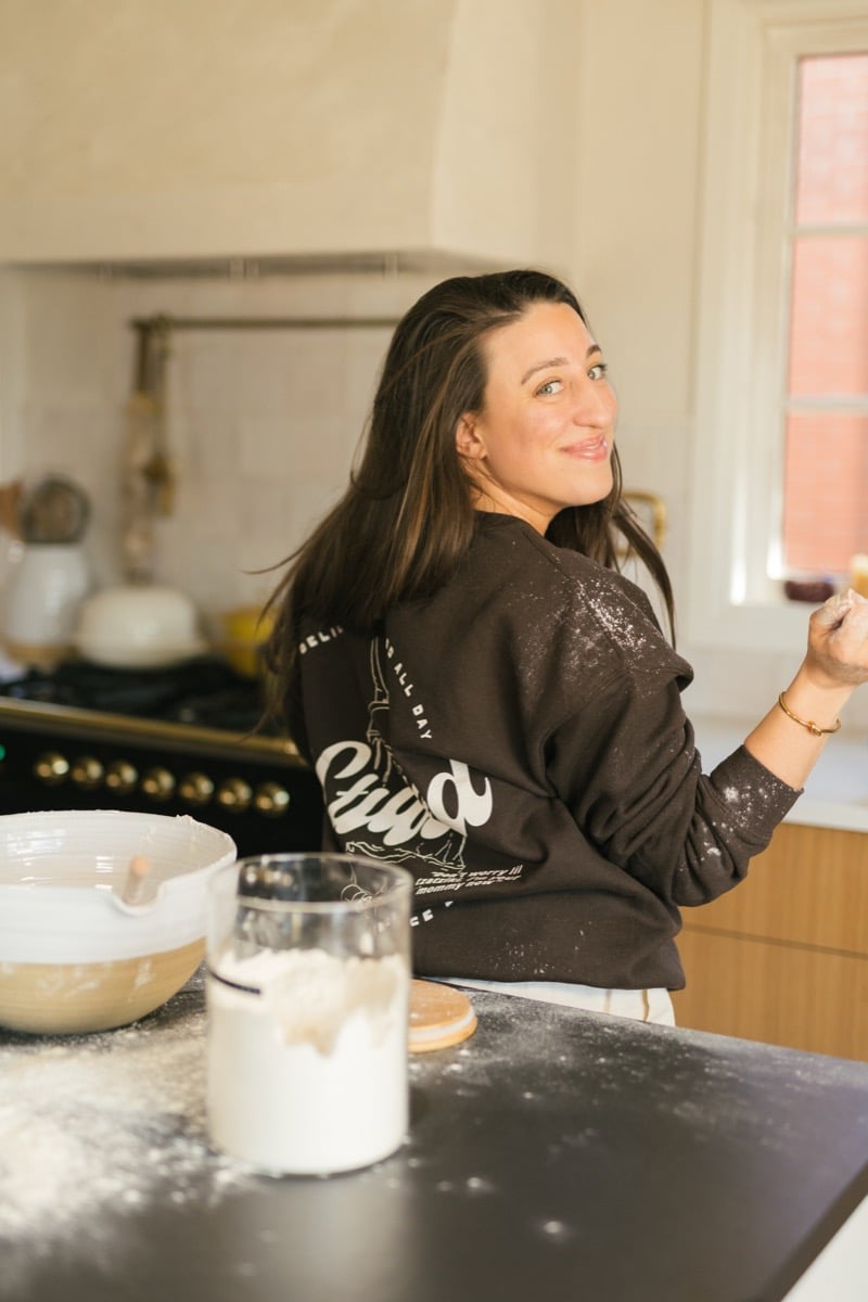Maria smiling at a table.