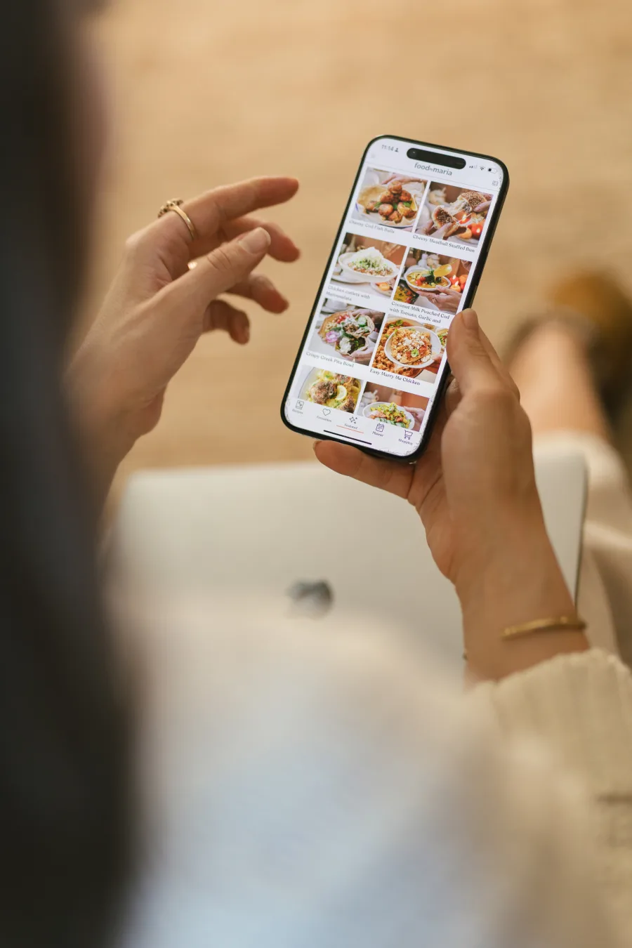 A phone showing the FoodByMaria app.