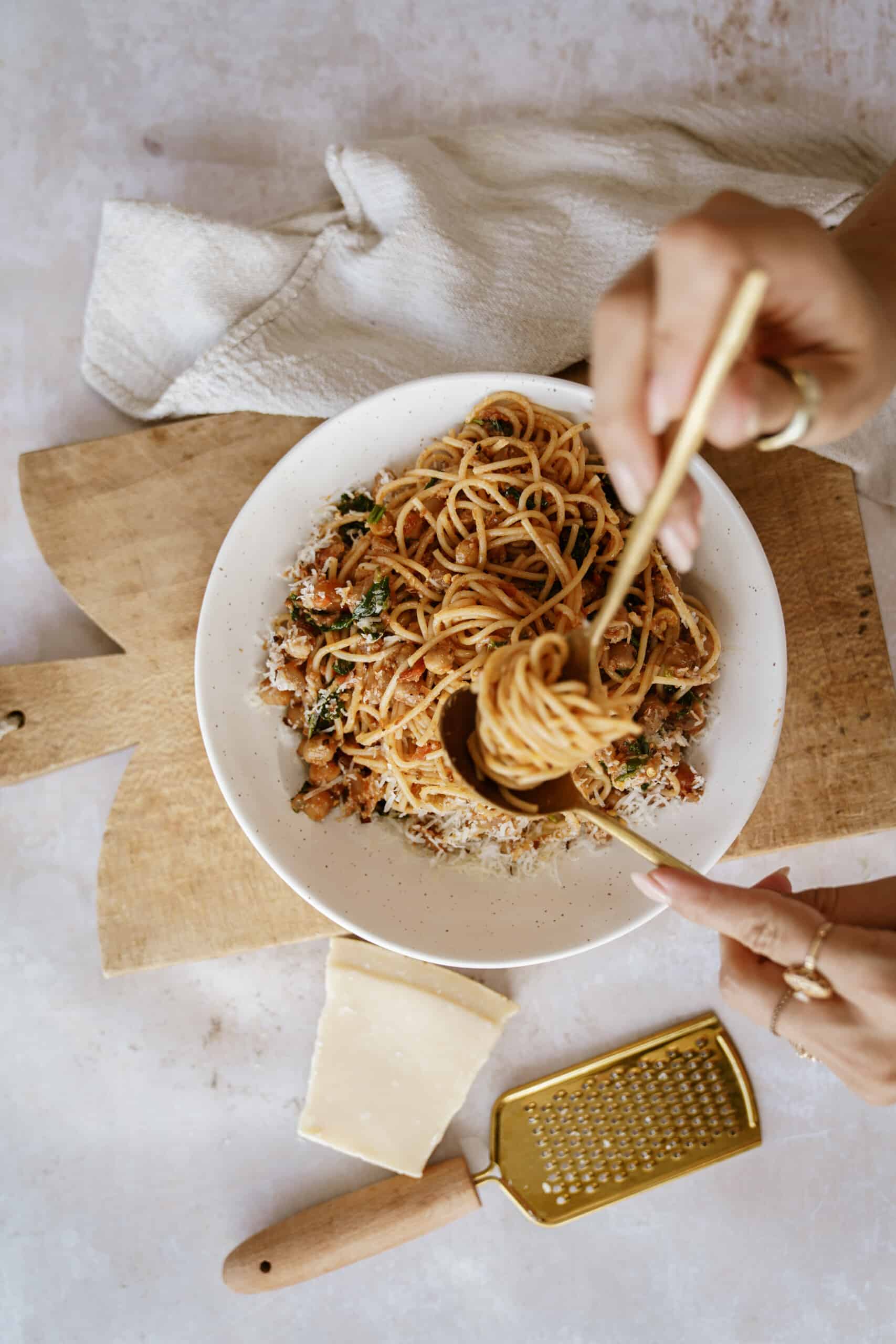 Chickpea pasta being twirled in white serving bowl