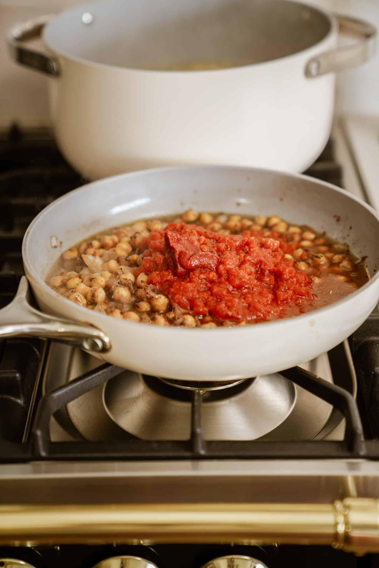 Chickpeas and tomato sauce in pan for chickpea pasta