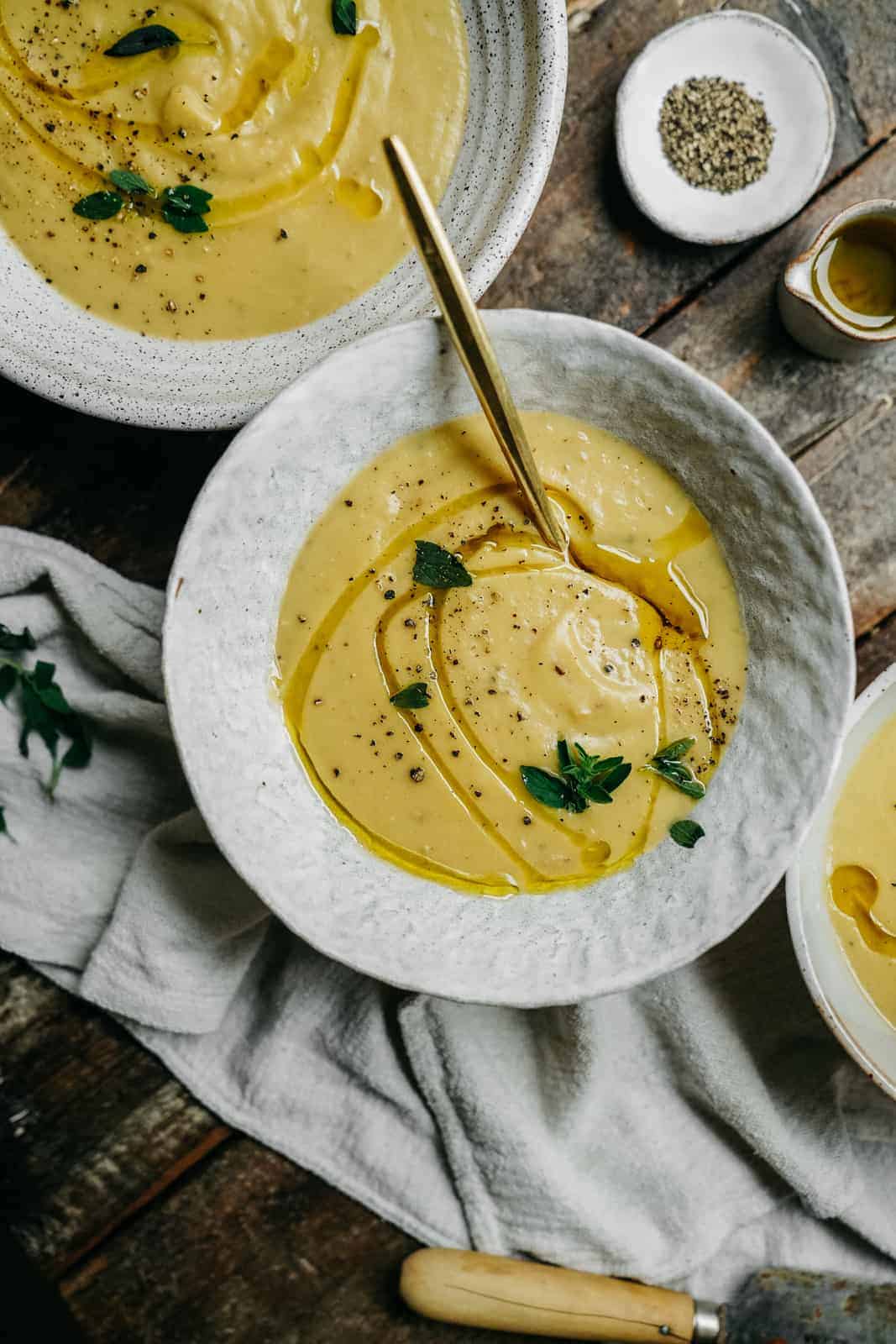 easy to make potato leek soup that's vegan and topped with fresh oregano and lime juice