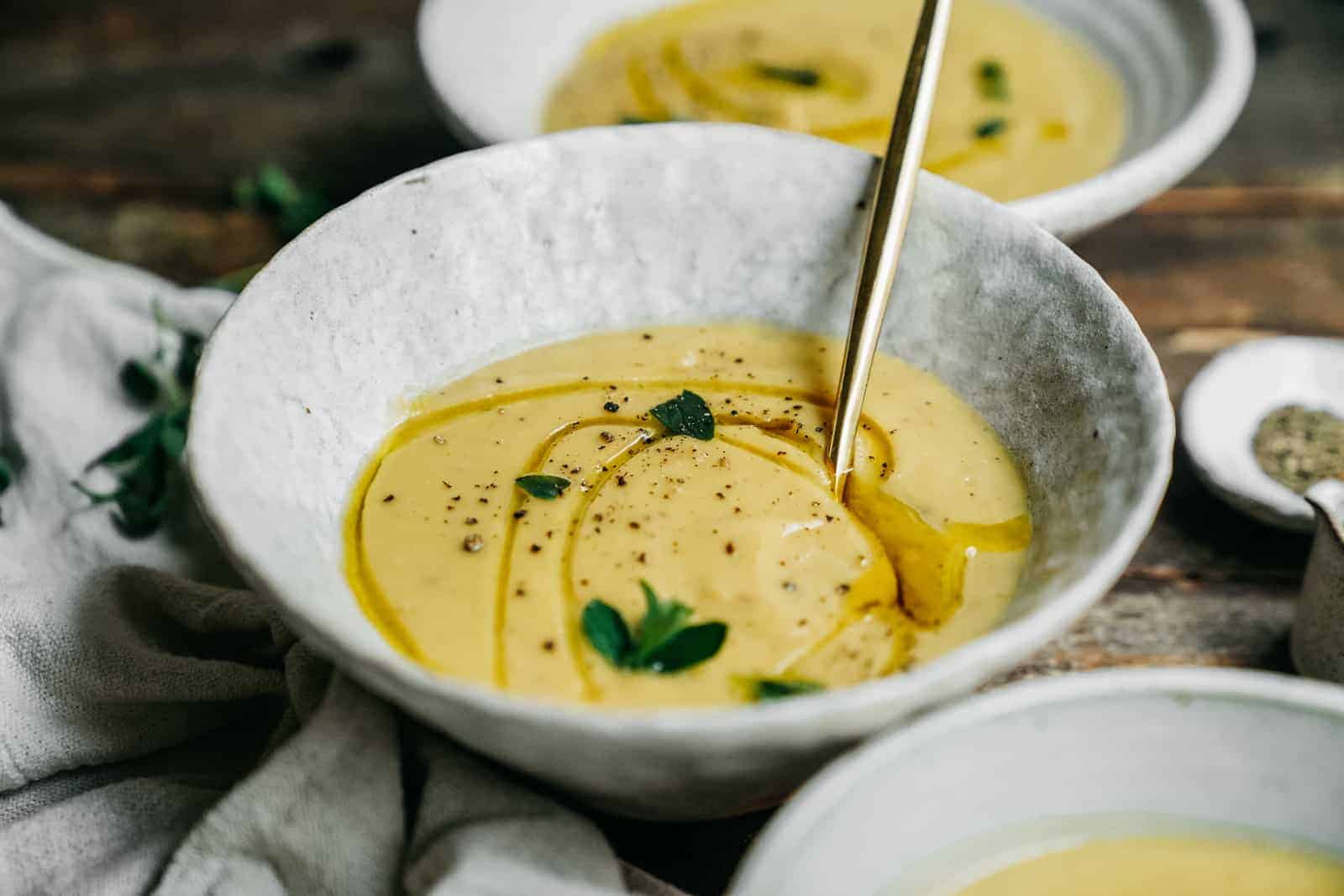 easy to make potato leek soup that's vegan and topped with fresh oregano and lime juice