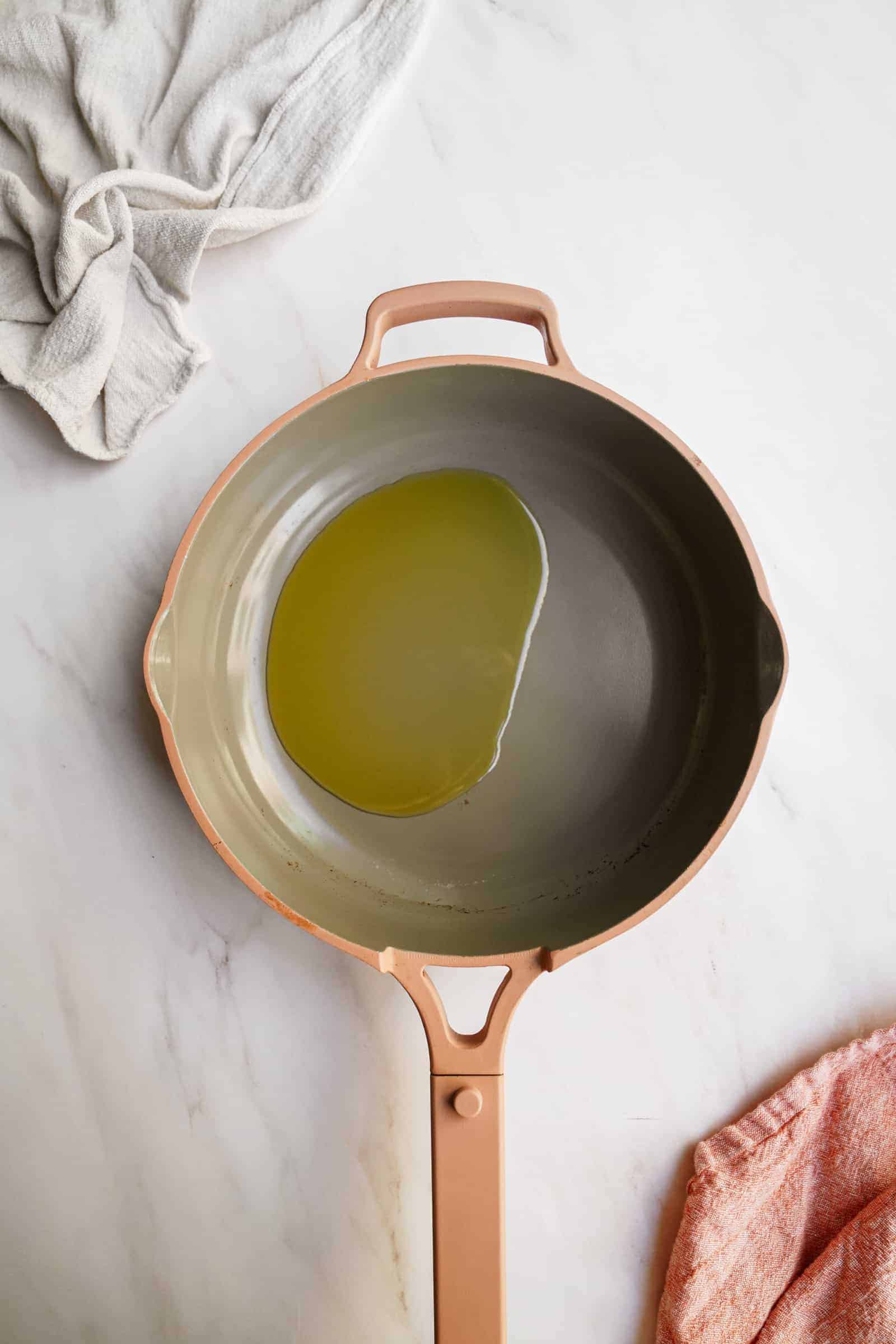 Olive oil in pan for vegan pasta recipes