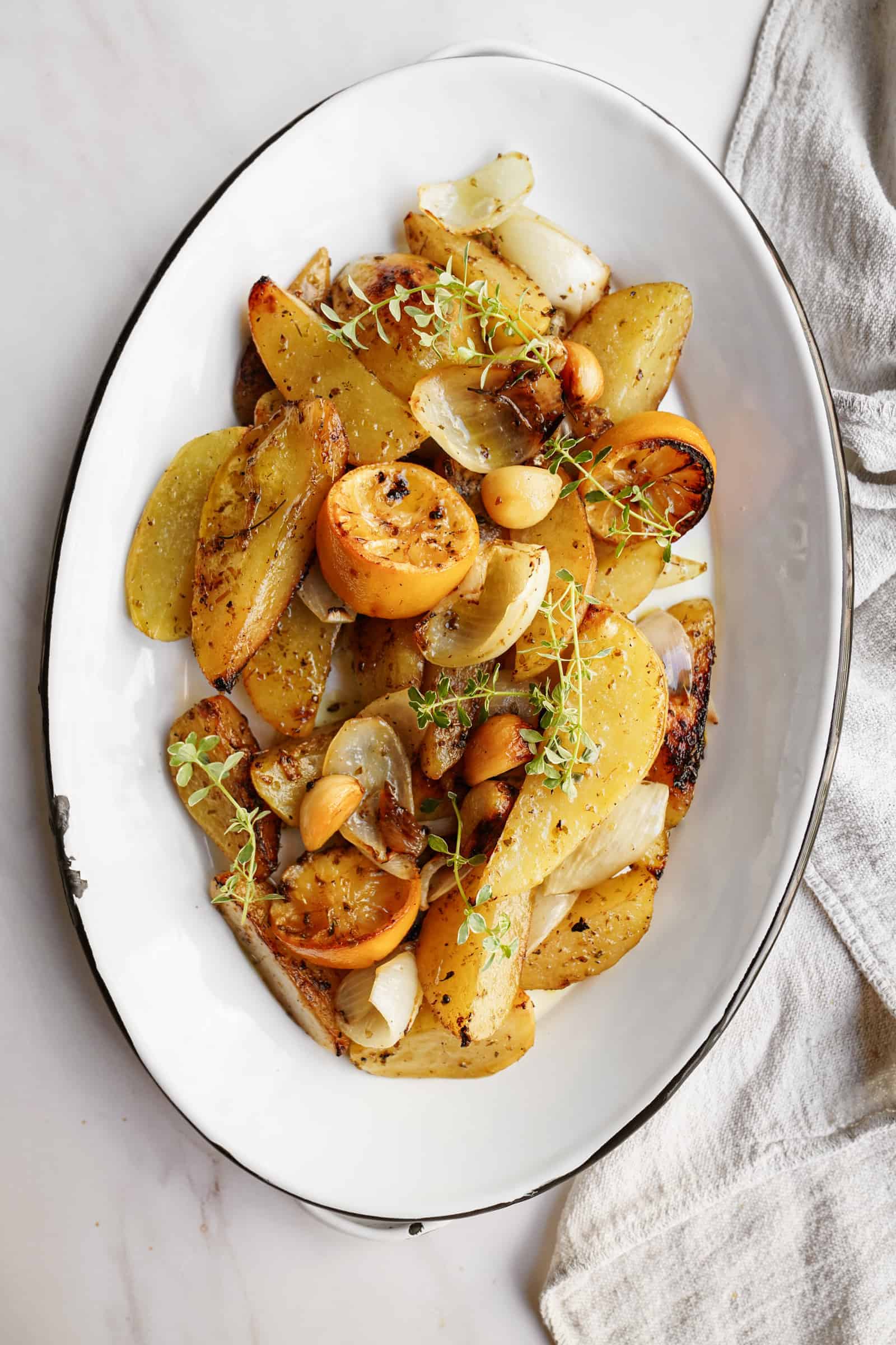Greek roasted potatoes on a serving platter