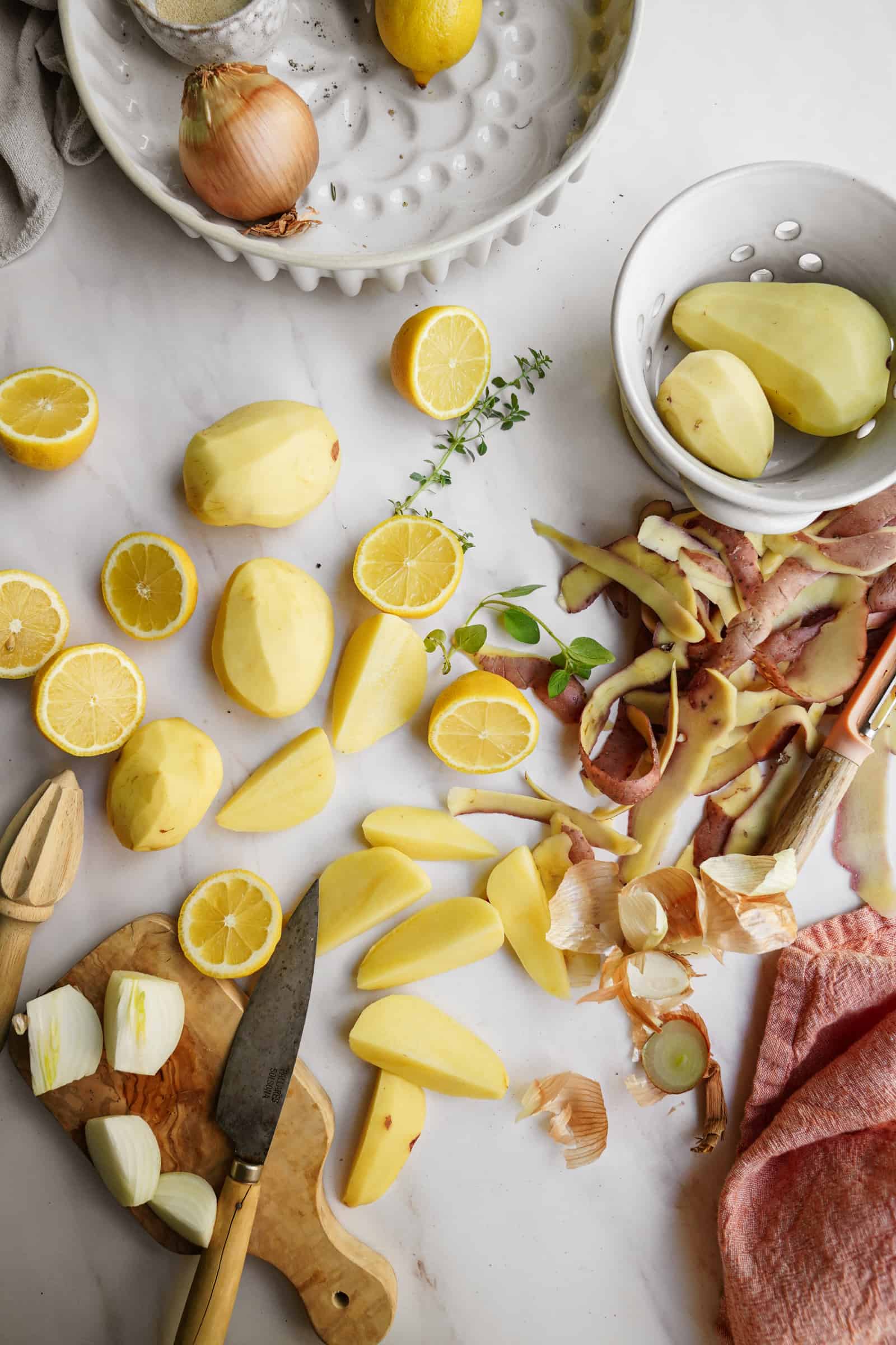 Peeled Greek potatoes on a countertop