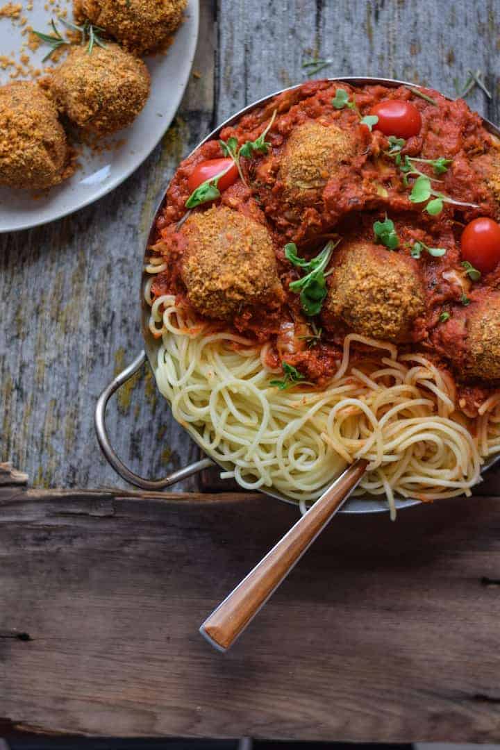 Vegan Pasta Recipe with meatless meatballs on counter ready to be served.