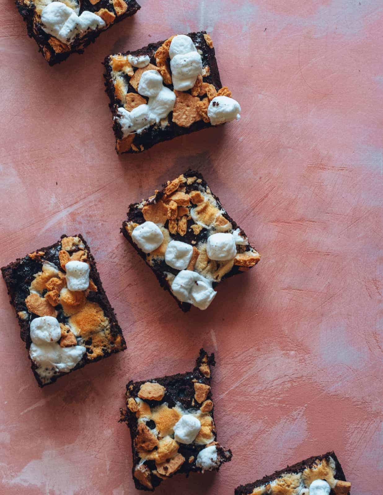 vegan s'mores brownies on pink countertop.