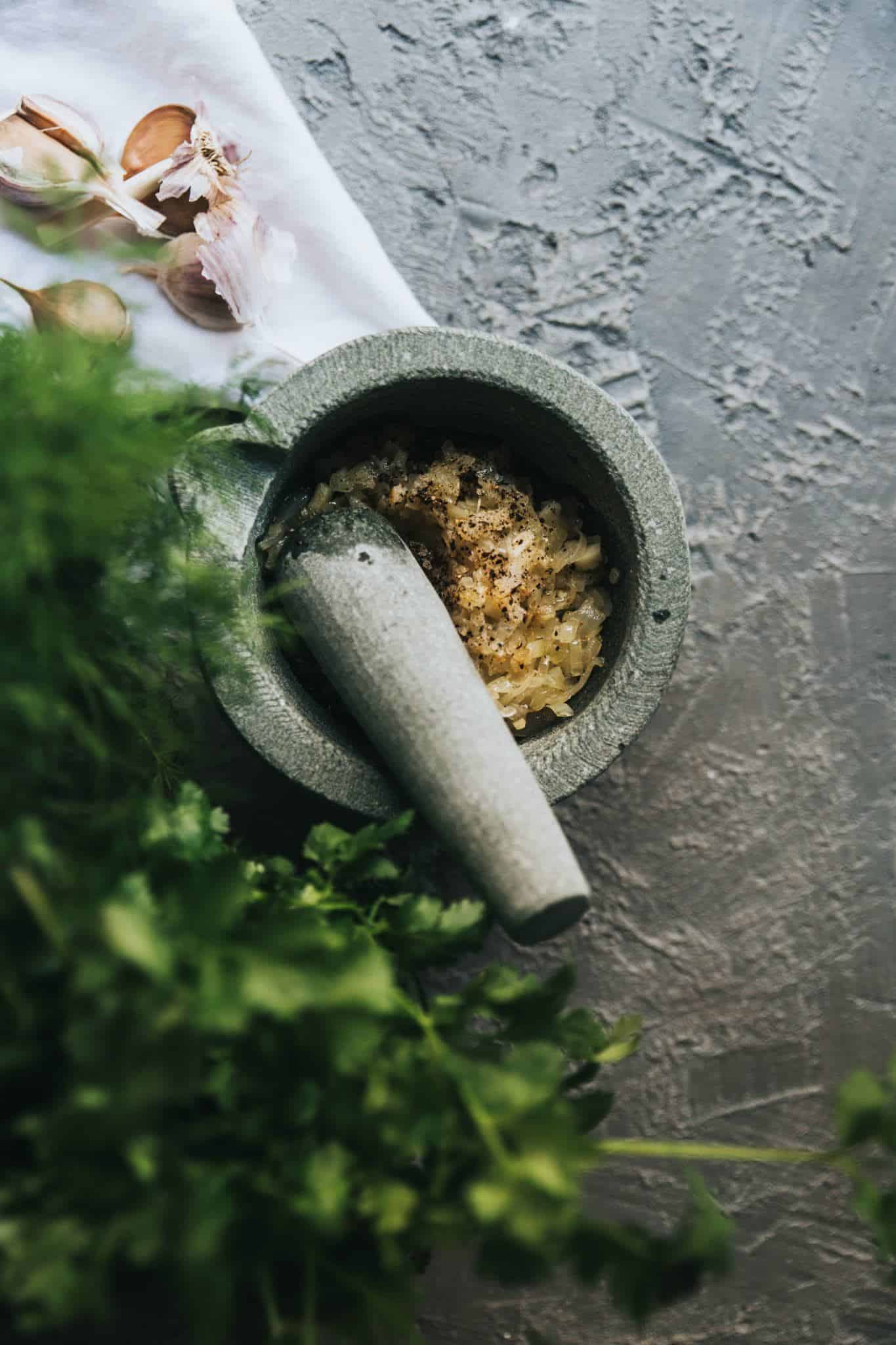 Fresh garlic waiting to be crushed for this delicious creamy vegan truffle pasta recipe. 