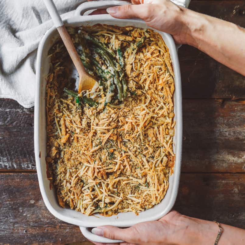 Take your holiday side dish to the next level with this vegan green bean casserole finished with a crunchy Triscuit cracker topping. 