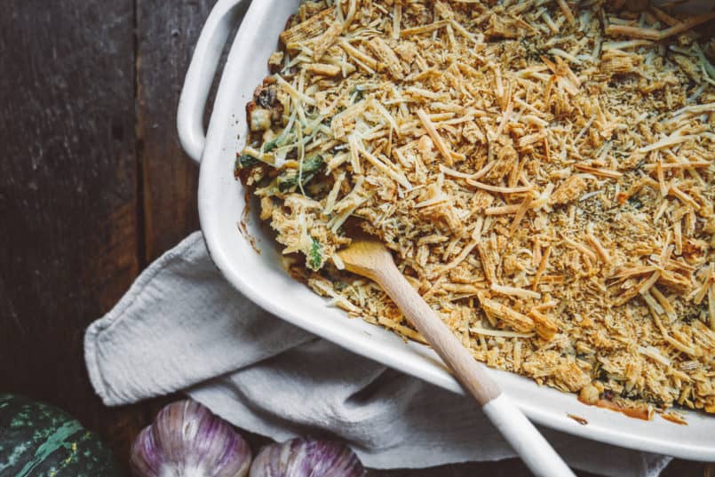 Take your holiday side dish to the next level with this vegan green bean casserole finished with a crunchy Triscuit cracker topping. 