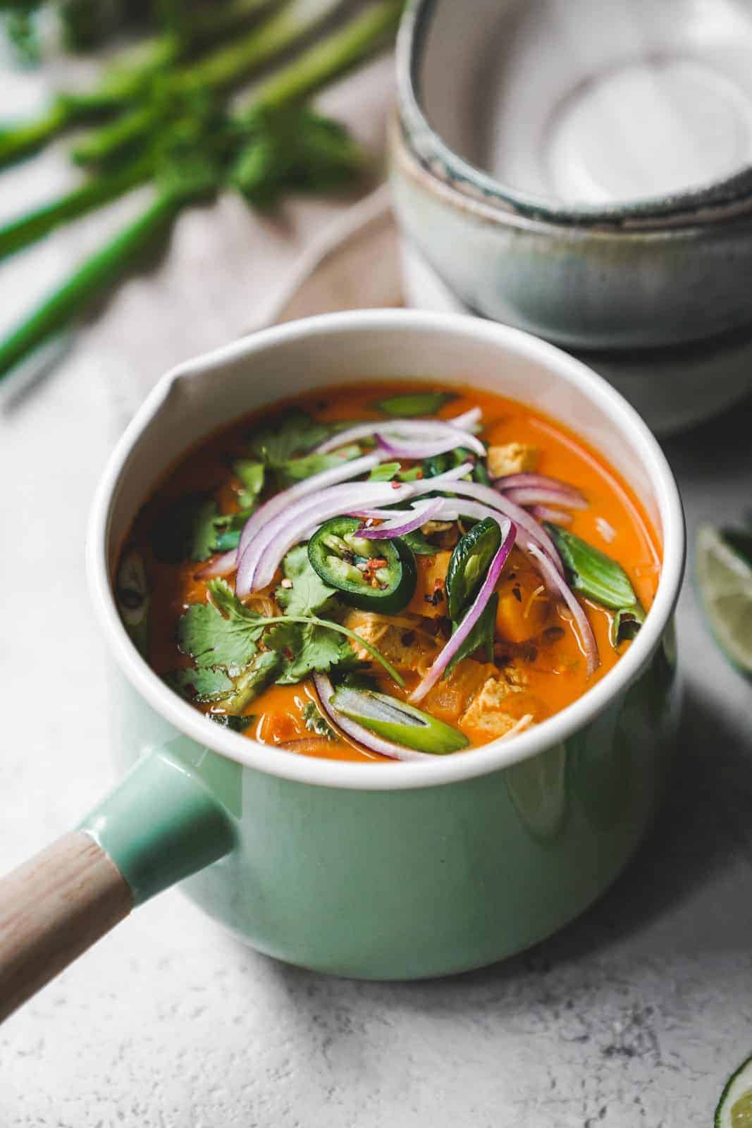 Colorful bowl of coconut curry soup
