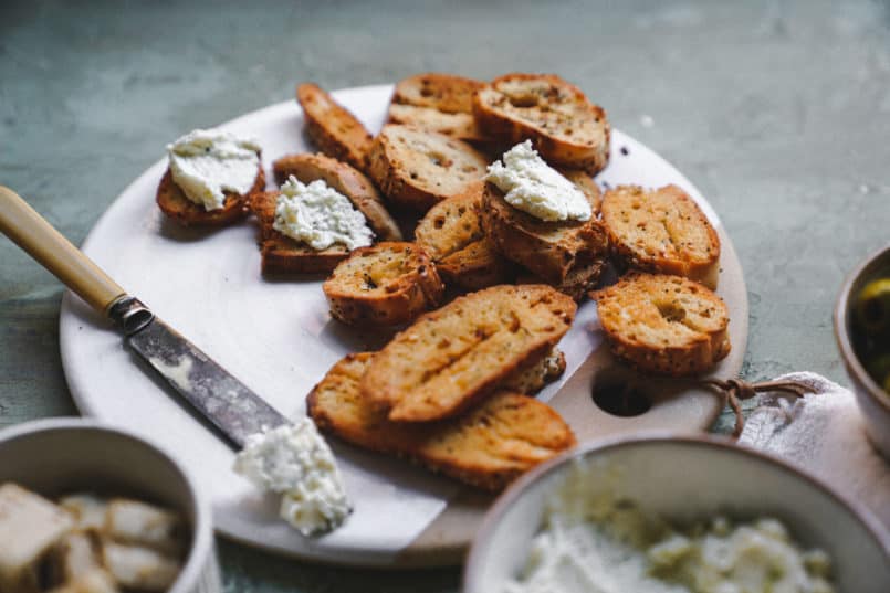 This vegan garlic herb cream cheese is so smooth and rich, it is perfect for spreading over the Silver Hills Organic Everything Bagels.