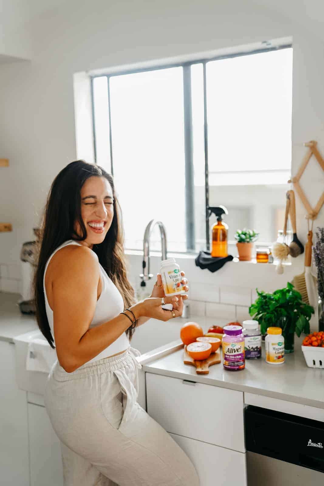 Maria of FoodByMaria in kitchen with Nature's Way vitamins