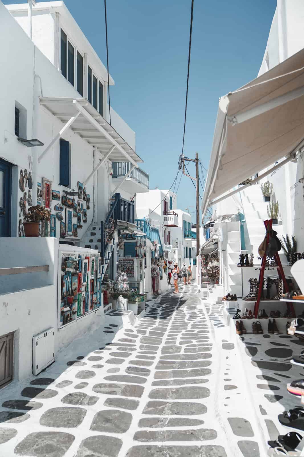 The beautiful white market streets of Mykonos, Greece.