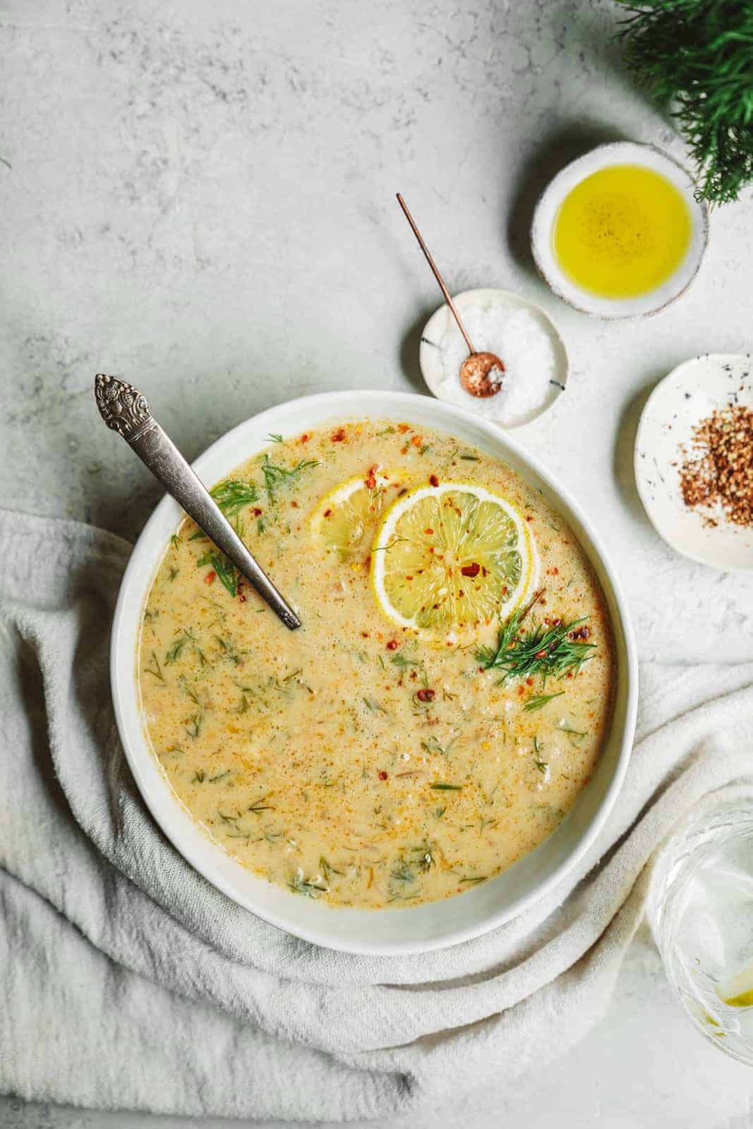 Greek Lemon Rice Soup in a bowl with a spoon