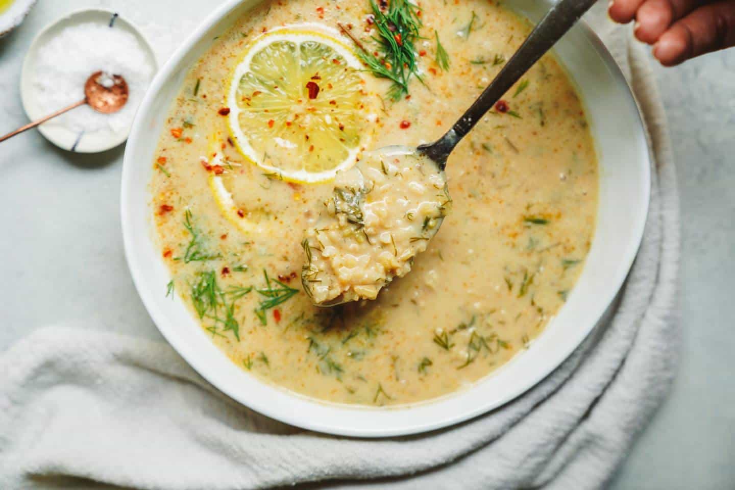 A spoonful of Greek lemon rice soup (avgolemono).