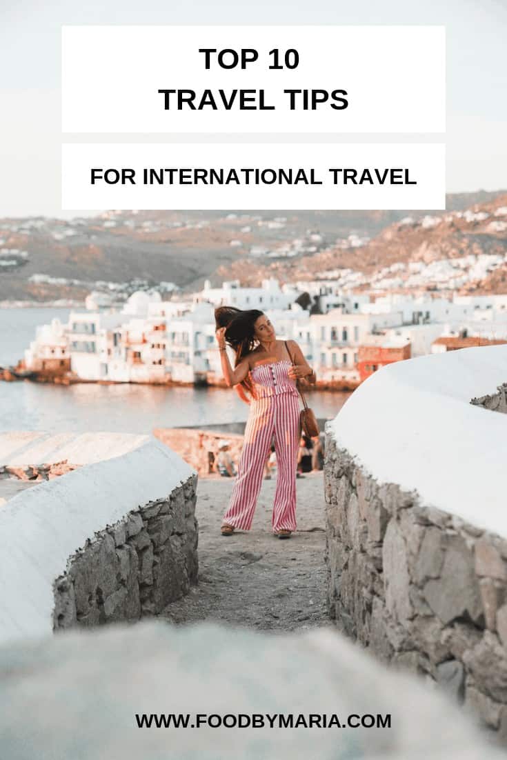 Pinterest pin for top international travel tips by FoodByMaria.