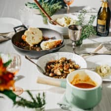 vegan brussel sprouts recipe on table with other thanksgiving foods