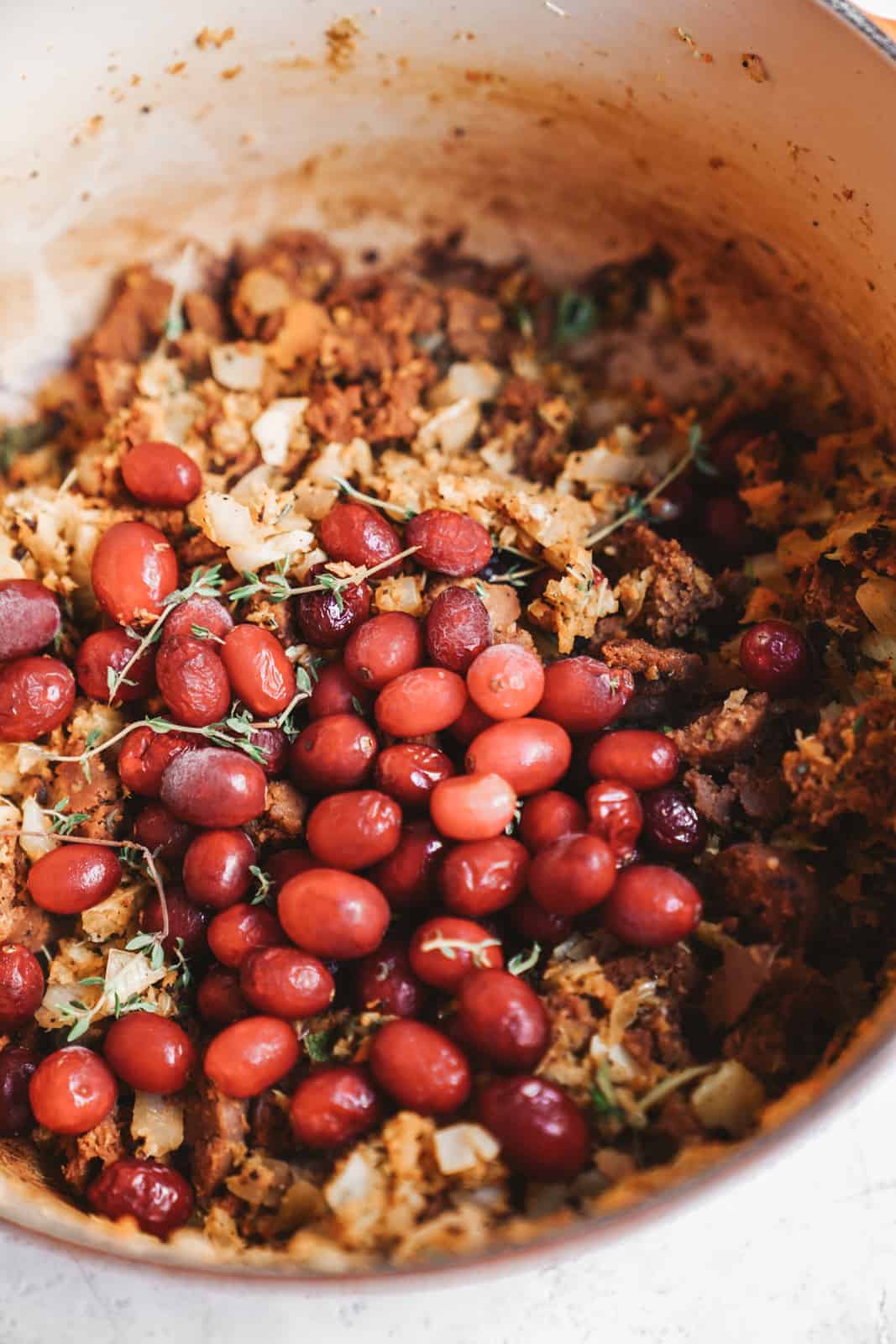 Big pot of vegan stuffing filled with yummy red cranberries. 