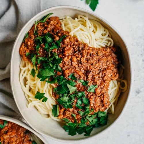 vegan spaghetti in big serving dish on counter
