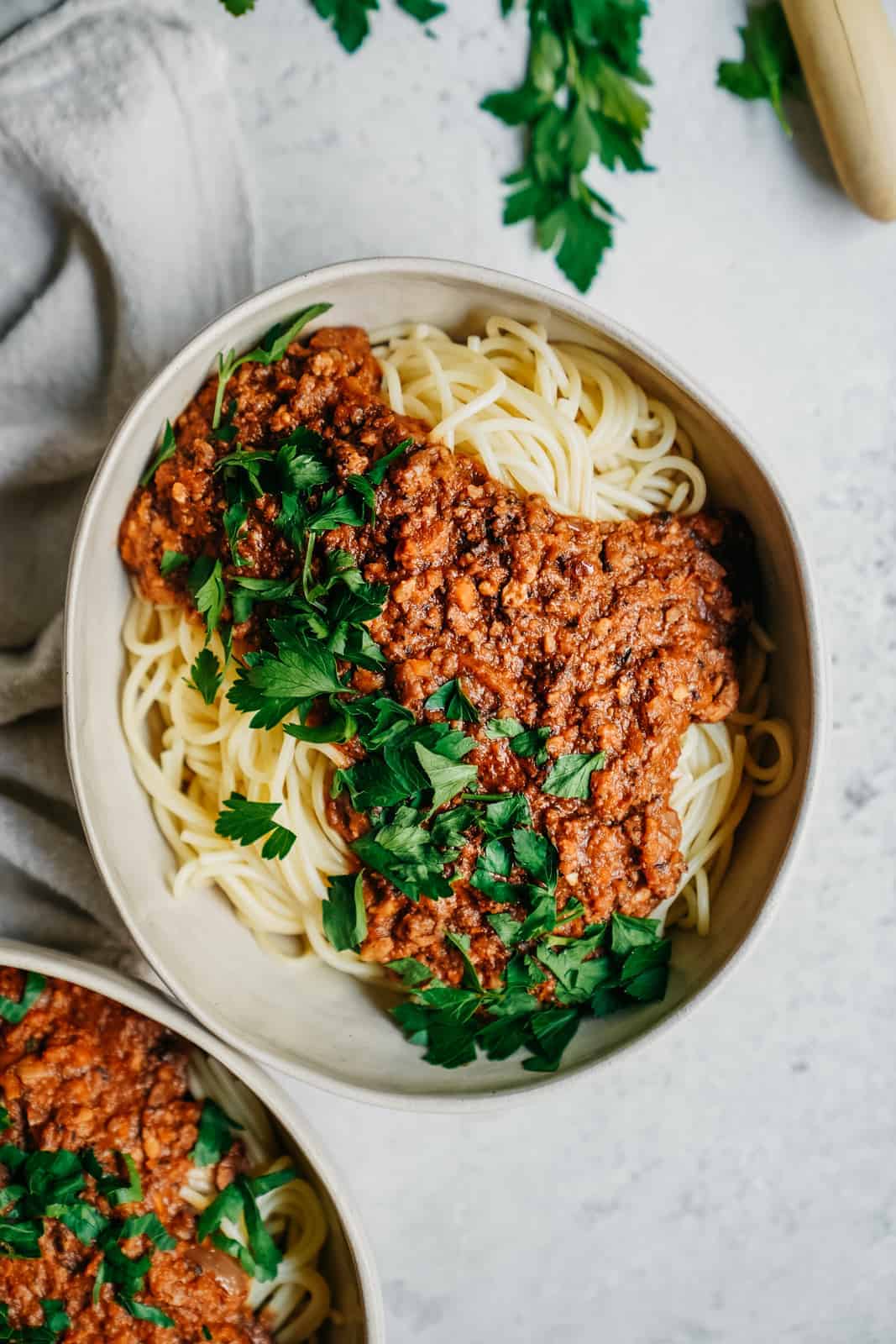 vegan spaghetti in big serving dish on counter