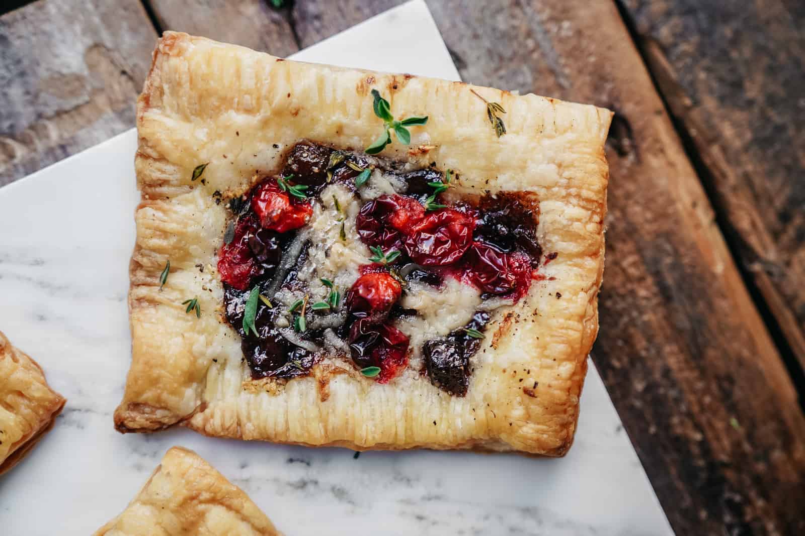 vegan cranberry cheese tarts on cutting board