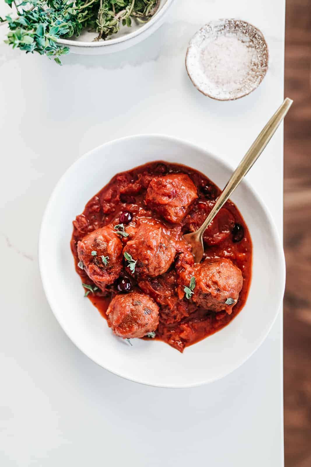 Yummy cranberry sauce meatballs in a serving dish.