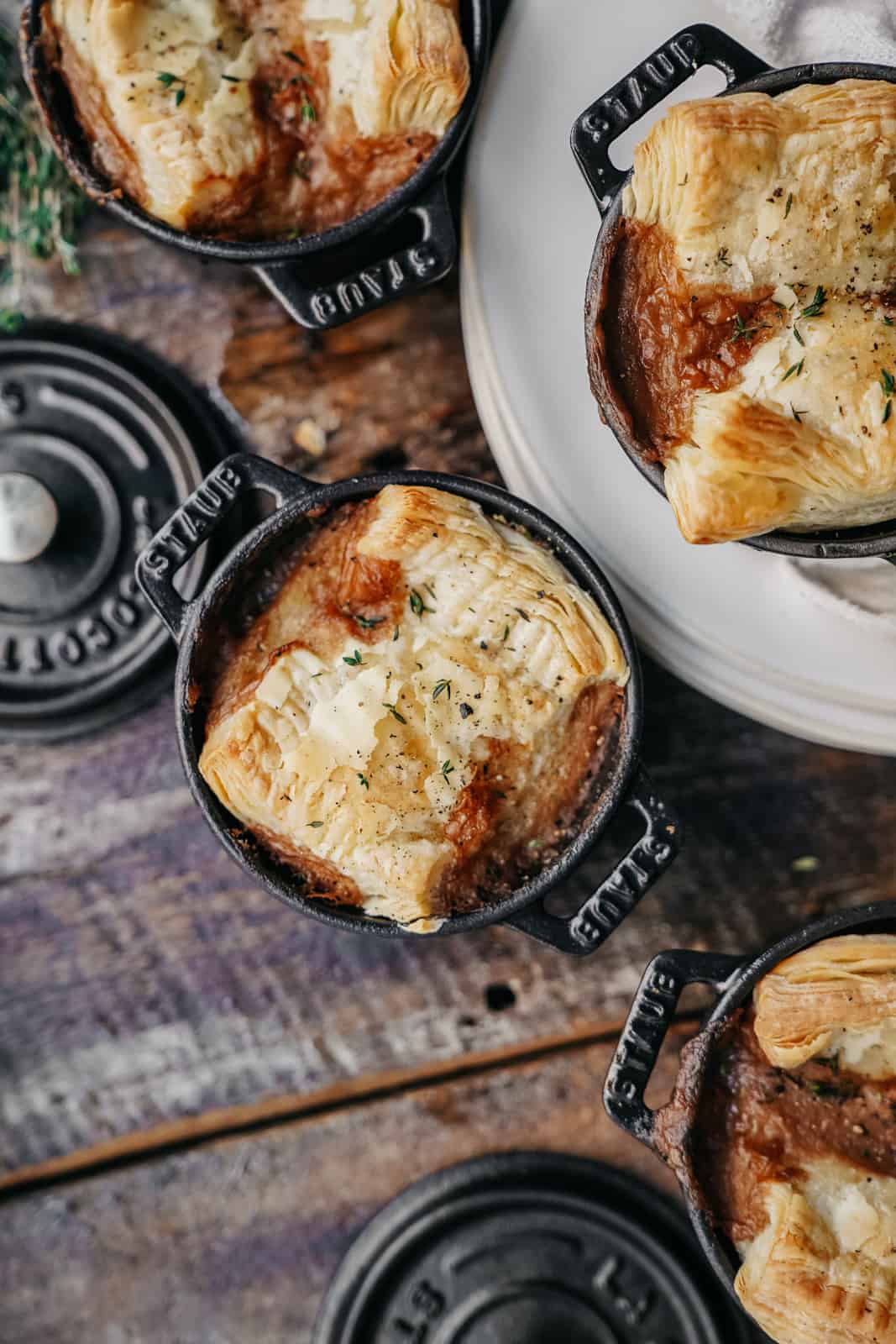 Ready-to-eat vegan pot pie with pastry crust in staub cocettes