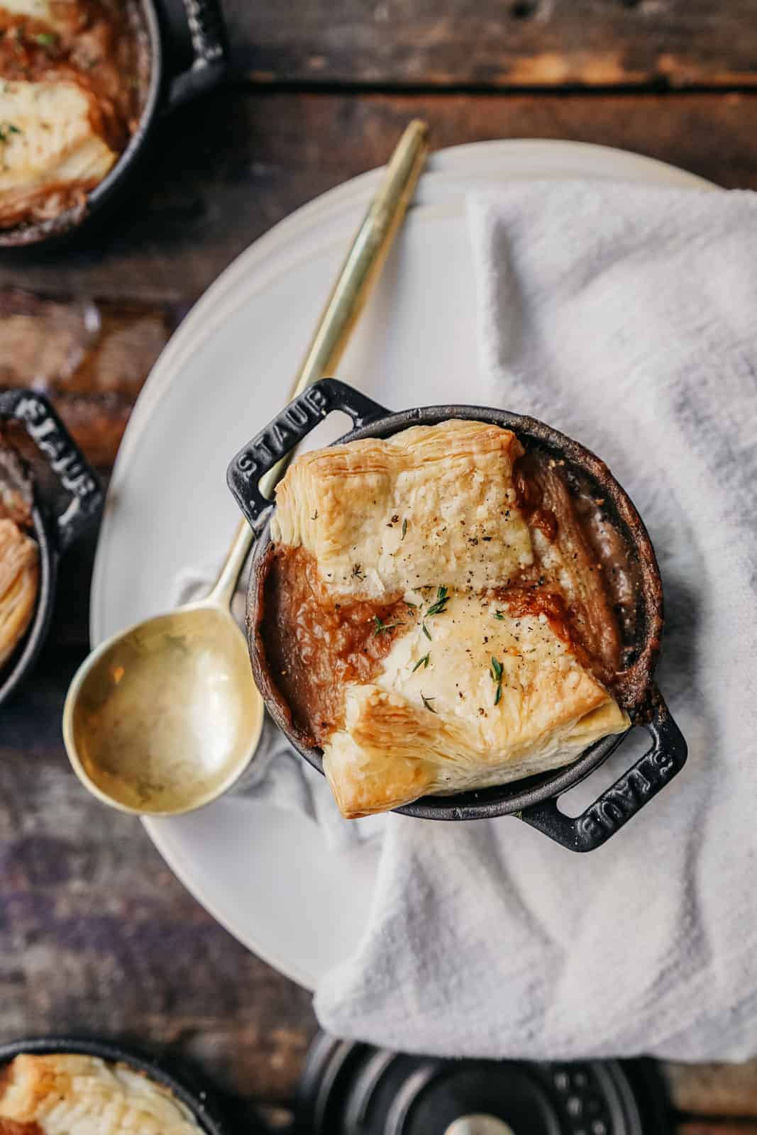 A pot pie on a wood board to demonstrate Maria's top food photography tips.