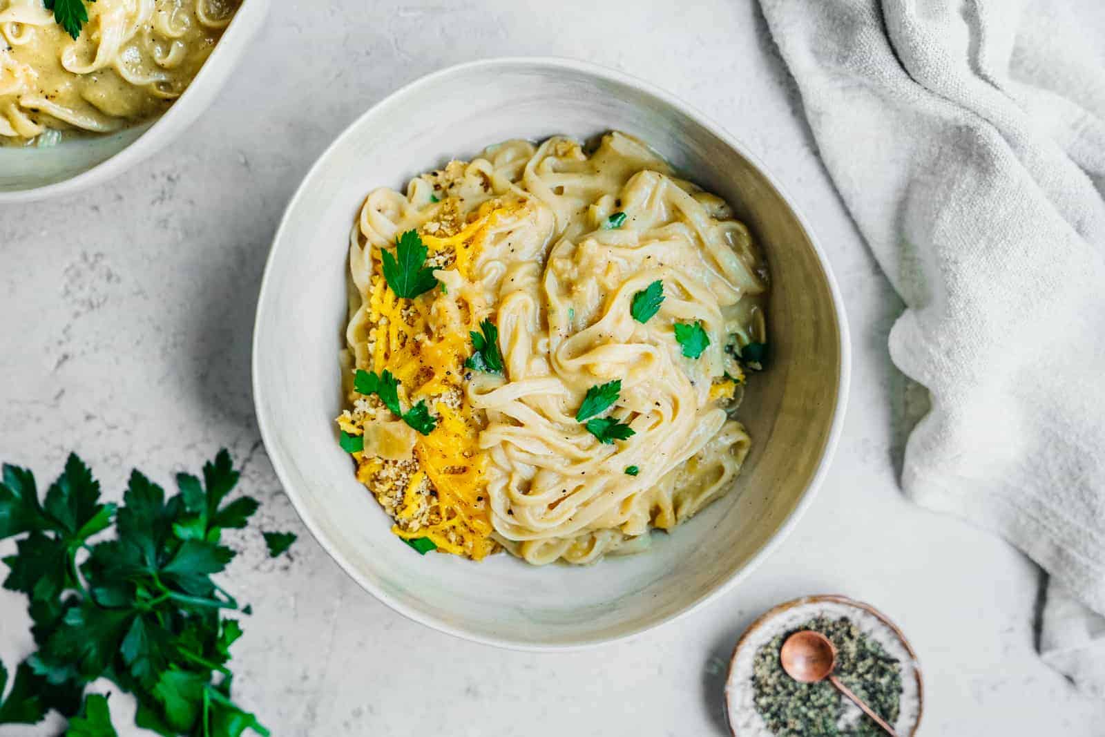 Cauliflower Cheese Sauce overtop NuPasta in pasta bowls