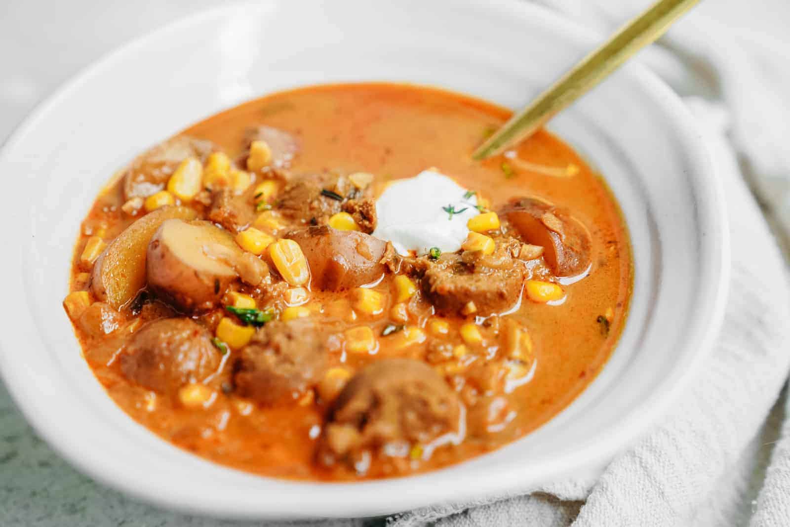 Close-up of vegan corn chowder in white bowl