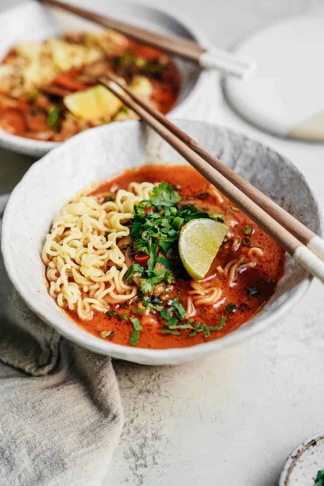 Creamy ramen with chopsticks on a countertop