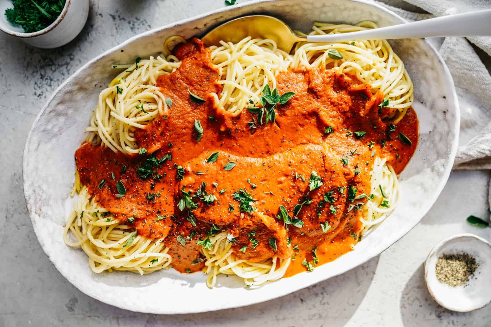 Big serving dish of spaghetti.