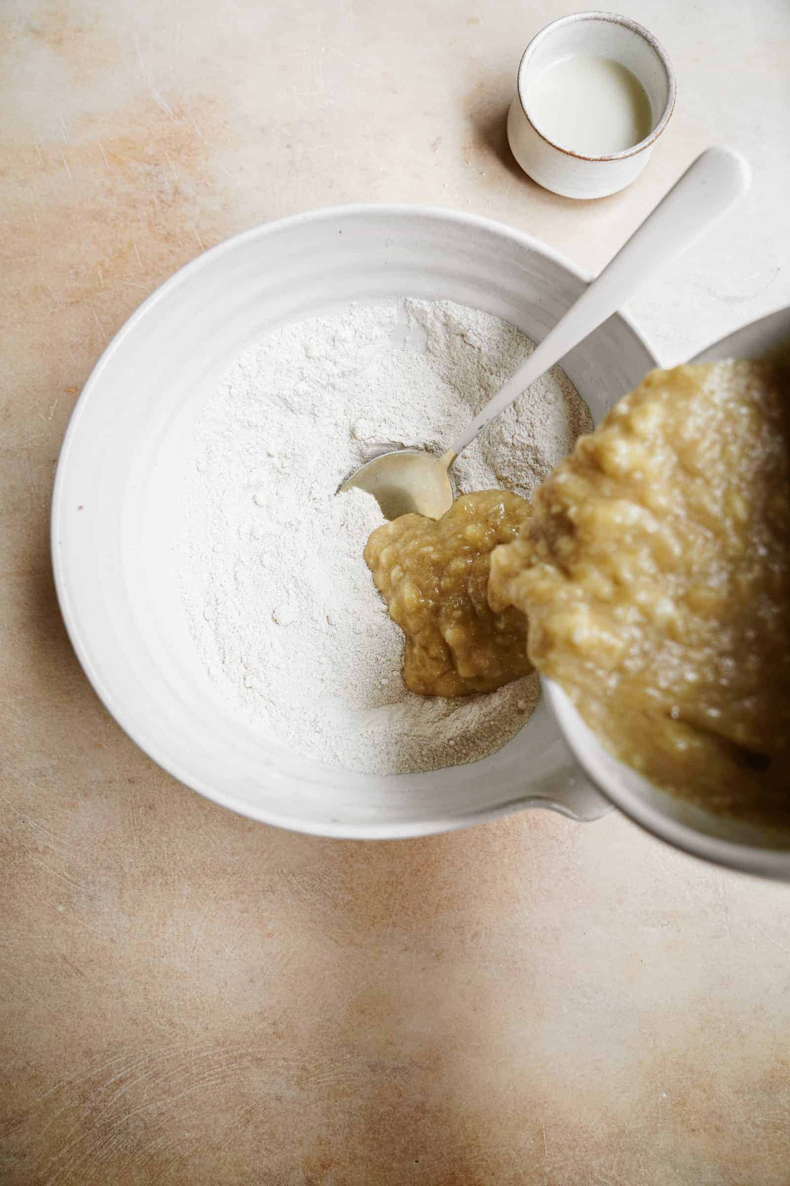 Mixing dry and wet ingredients into a bowl