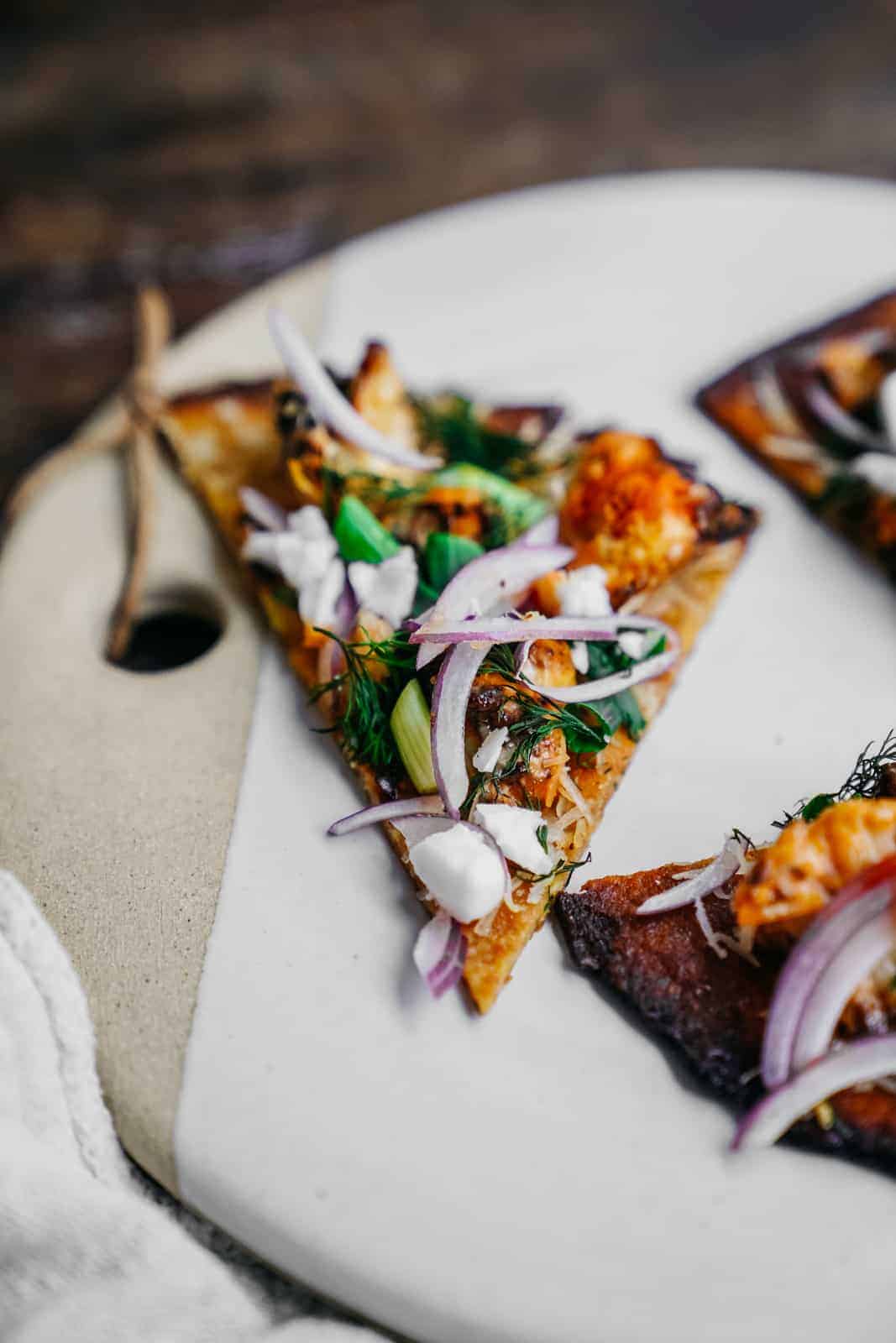 vegan cauliflower pizza crust on a plate