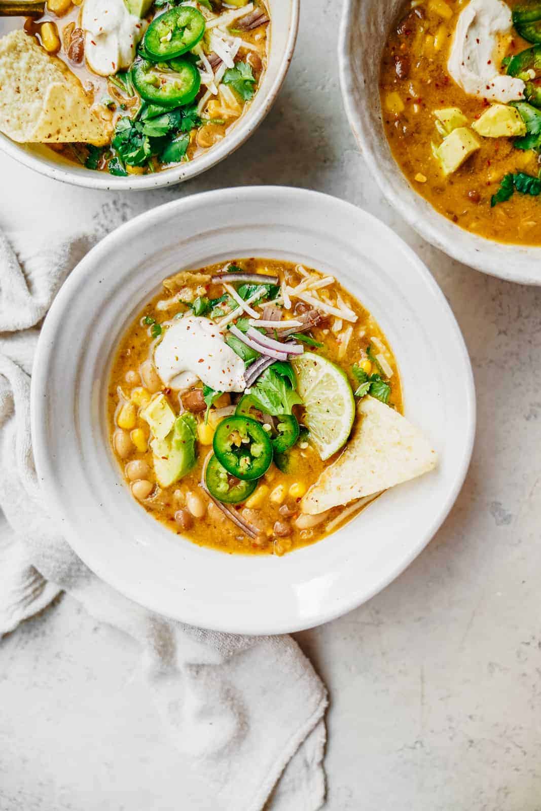 Vegan White Bean Chili covered in all kinds of favorite toppings.