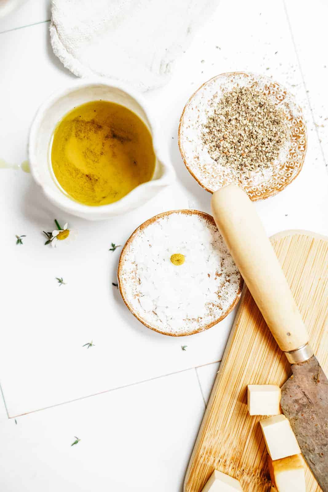 Ingredients on countertop with cutting board.