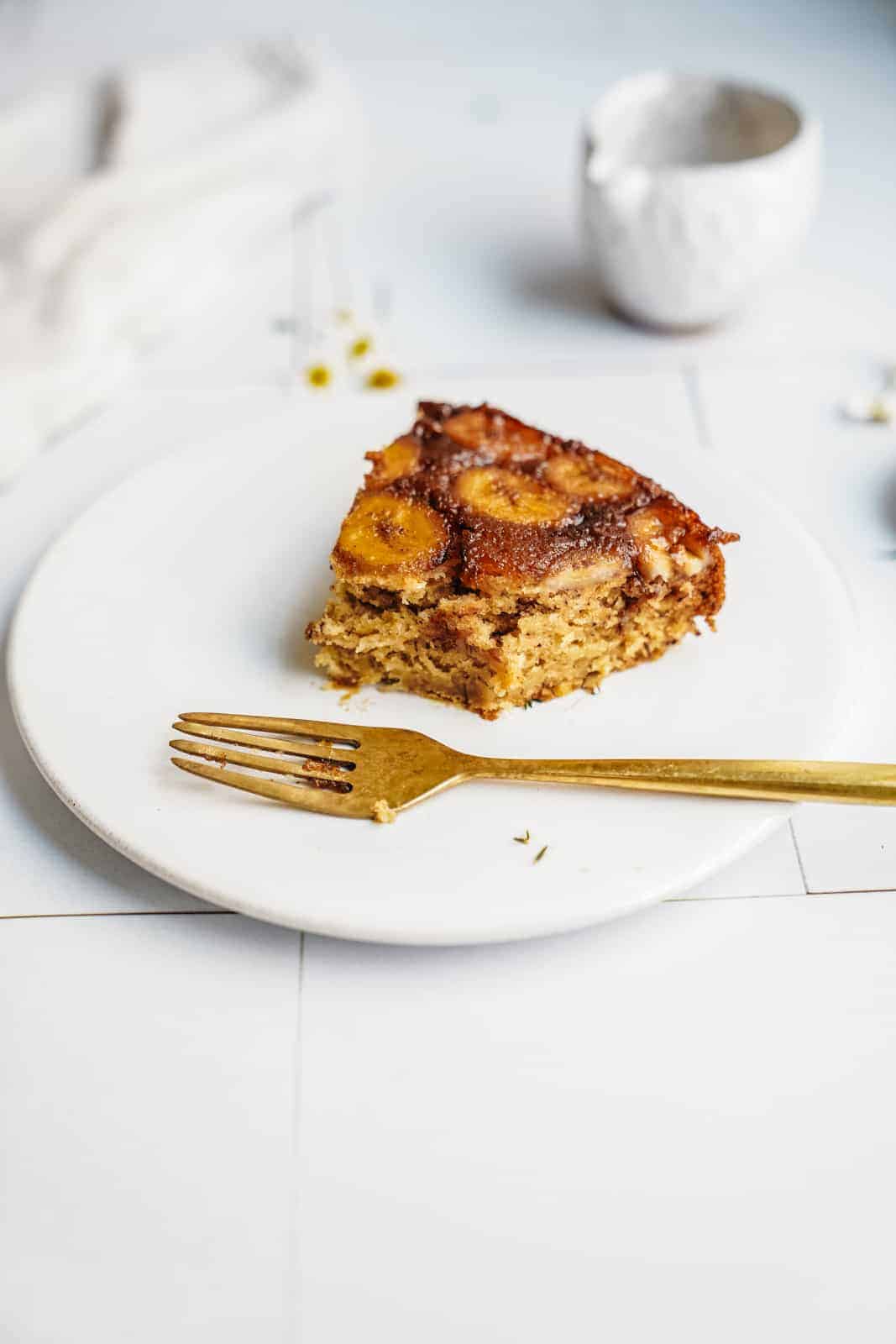 Slice of banana bread cake on a plate with a fork