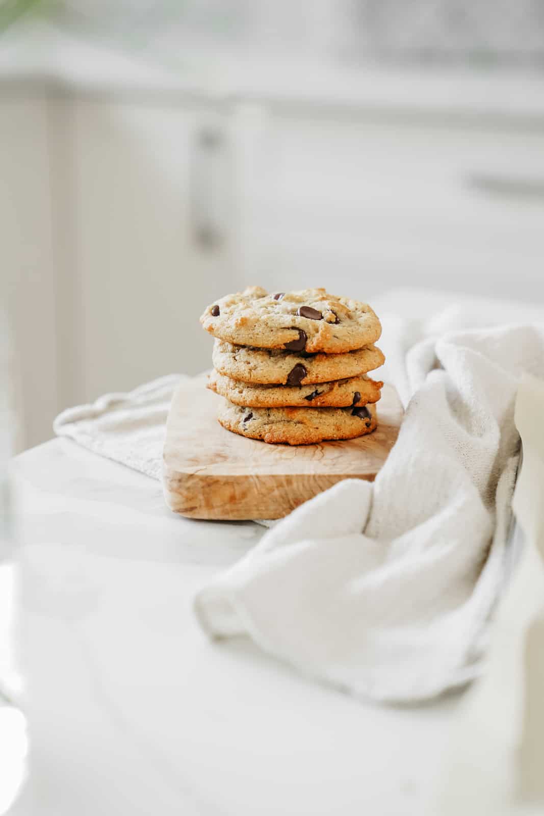 Stack of banana chocolate chip cookies on a counter