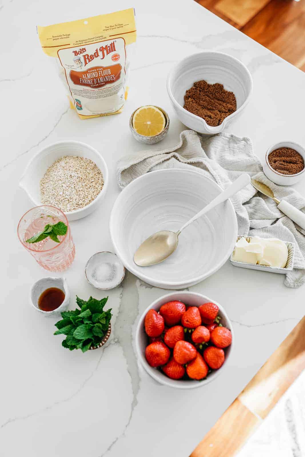 Ingredients for Strawberry Crumble Bars laid out on countertop.