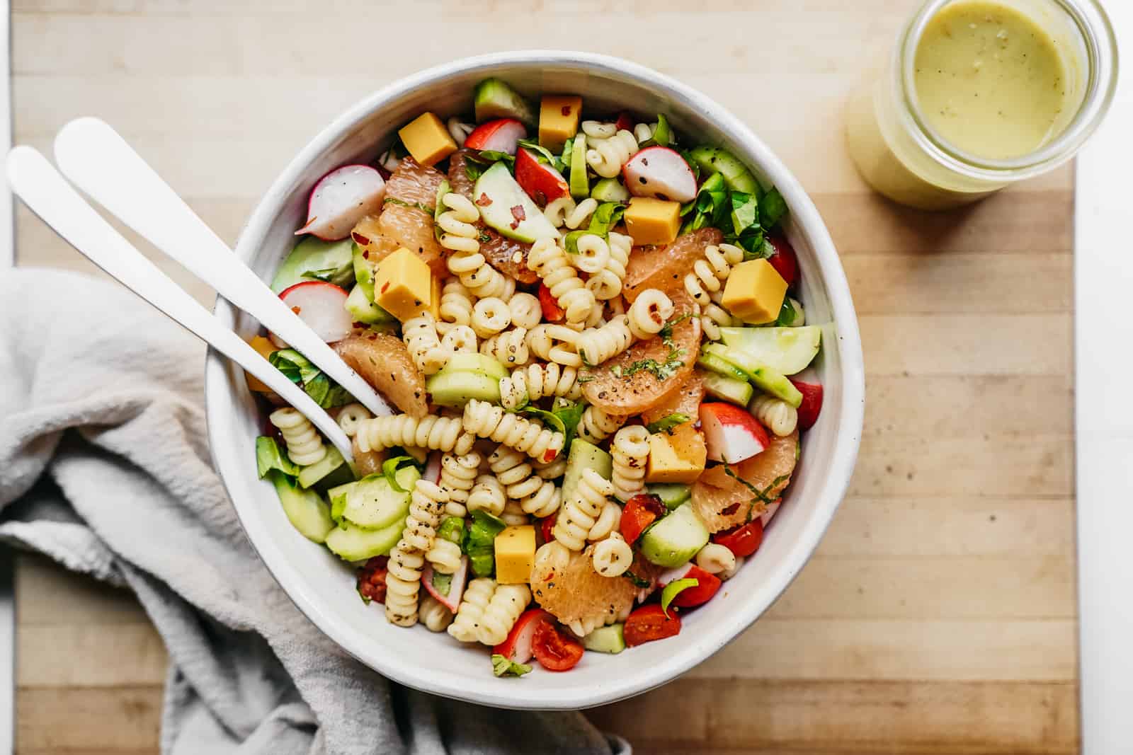 Colourful bowls of fresh pasta salad ready to be served.