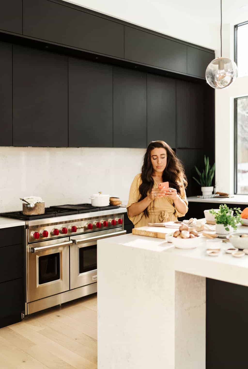 Maria, a food blogger, in a kitchen preparing food.