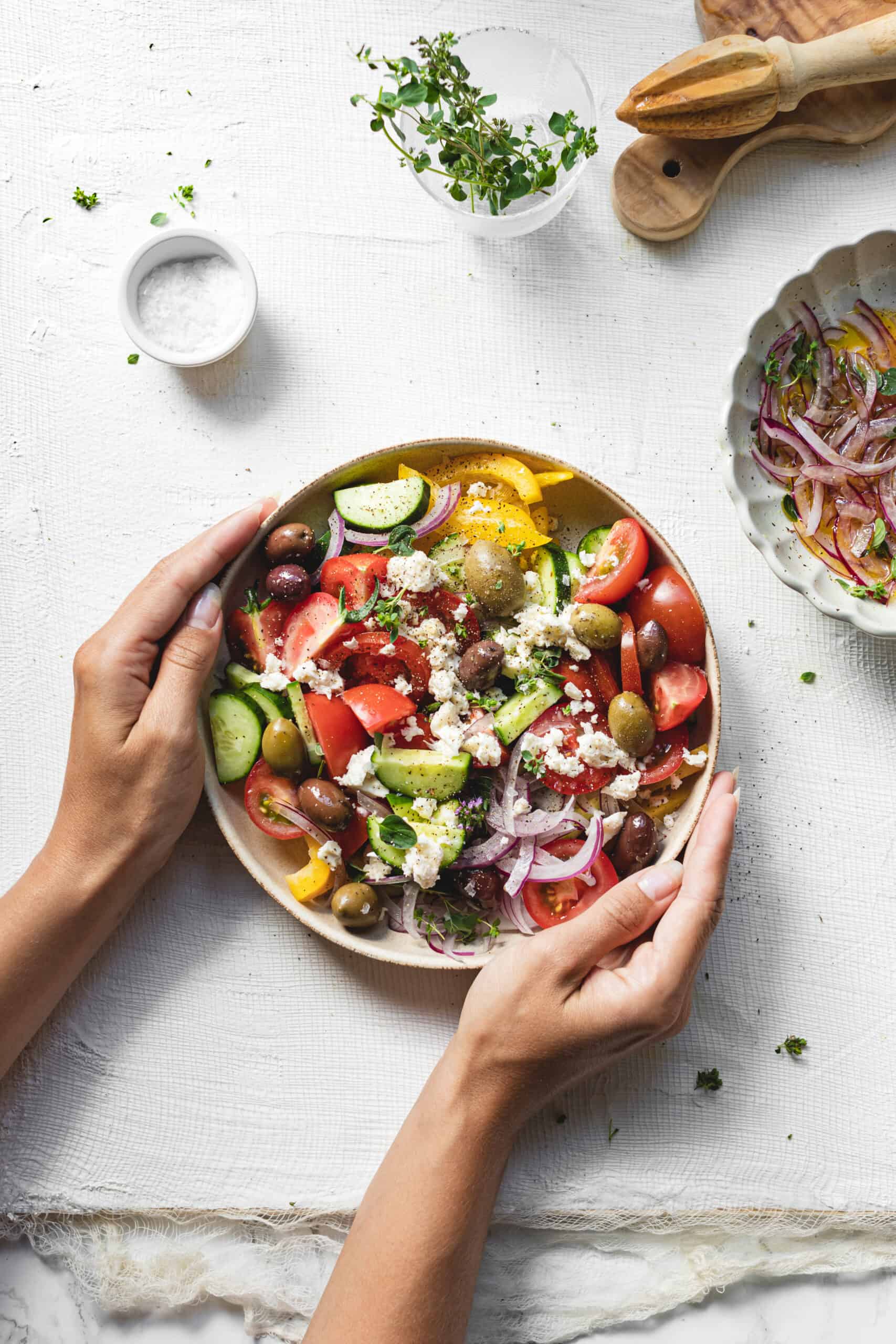 Simple Homemade Greek Salad being served on table