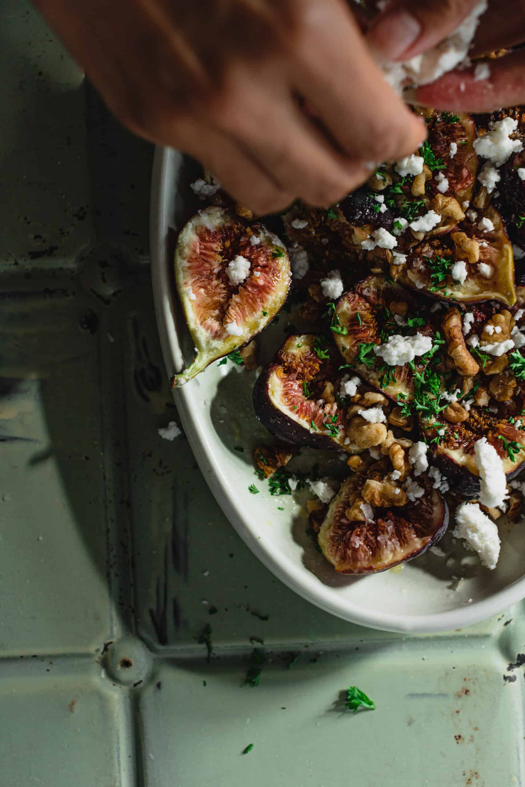 A close up of feta being added to the Simple Fresh Fig Salad