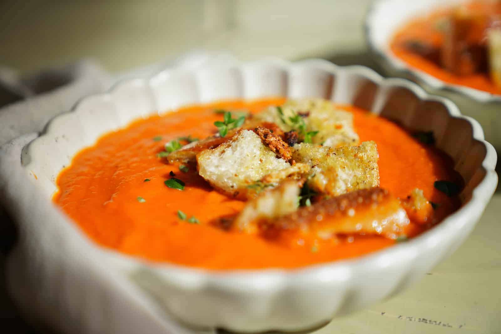 Side angle of Roasted Tomato Soup in white bowl