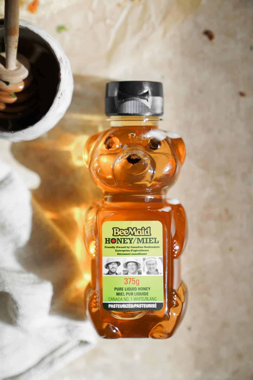 A bottle of honey shaped as a bear for the Vegetarian Breakfast Pizza