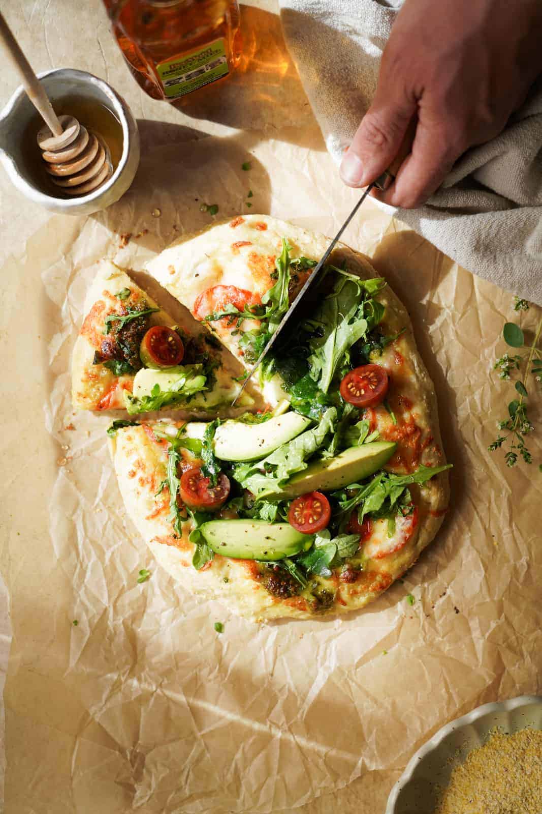 Cutting a slice of the Vegetarian Breakfast Pizza