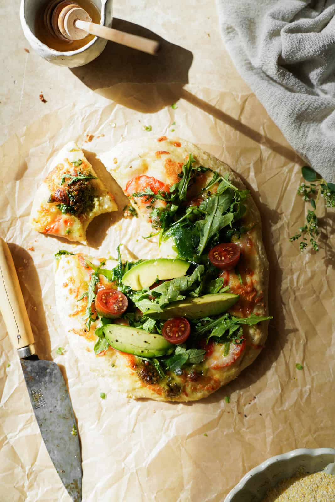 A slice being cut from a Vegan Breakfast Pizza