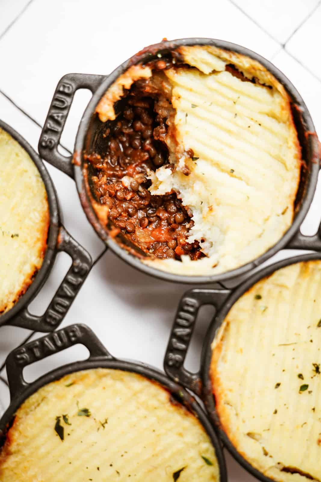 Lentil Shepherd's Pie in mini pots on counter 